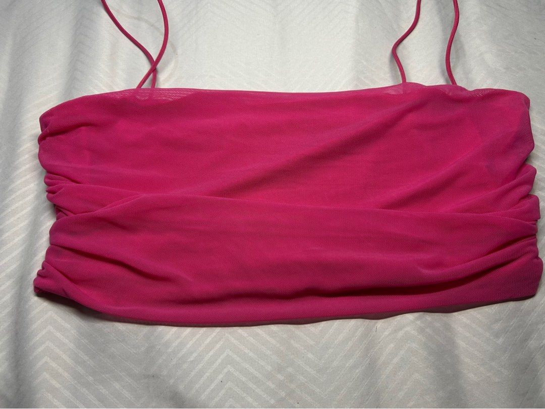 Hot Pink Mesh Ruched Tube Top (Category: Others Tops) located in Manila. Submitted by fromrie (Listing ID 1455095699, Image 1). Description: - Super cute hot pink mesh tube top - Features a ruched front for a flattering fit - Adjustable tie details on the sides for a customized look - Stretchy material for comfort and flexibility - Perfect for a night out or a festival outfit - Easily pairs with jeans or skirts for a stylish ensemble .