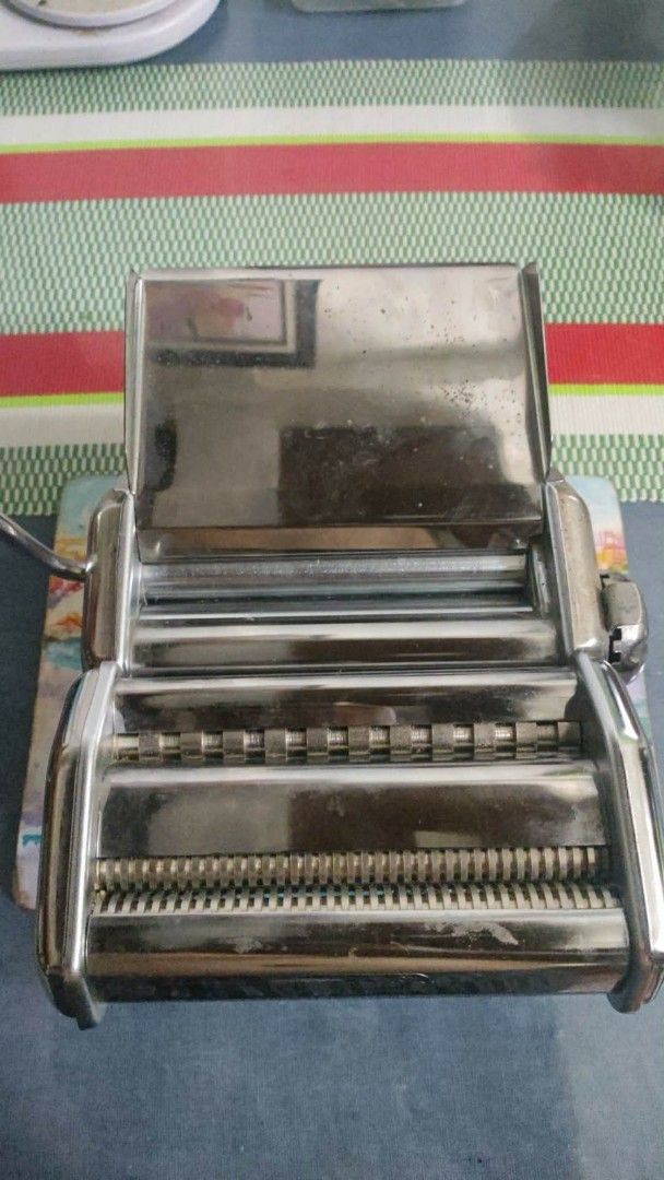 Imperia iPasta Maker Made in Italy (Category: Other Kitchenware & Tableware) located in Quezon City. Submitted by cmcsupremes (Listing ID 1454978425, Image 1). Description: - Fundraising sale for Cheryl's chemotherapy and hospitalization - Price negotiable - Imperia iPasta Maker for homemade pasta - Durable stainless steel construction - Includes clamp and handle for easy operation - Create fresh ravioli, fettuccine, and more - Simple to use and 