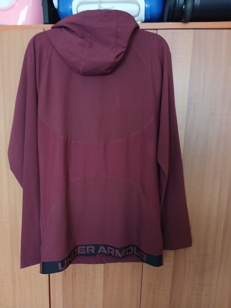 Jacket (Category: Coats, Jackets and Outerwear) located in Singapore. Submitted by vastcloud_cc09d7 (Listing ID 1454971892, Image 3). Description: - Brand: Under Armour - Color: Maroon - Size: M - Condition: Used a few times only - Features: Hooded jacket with full zip.
