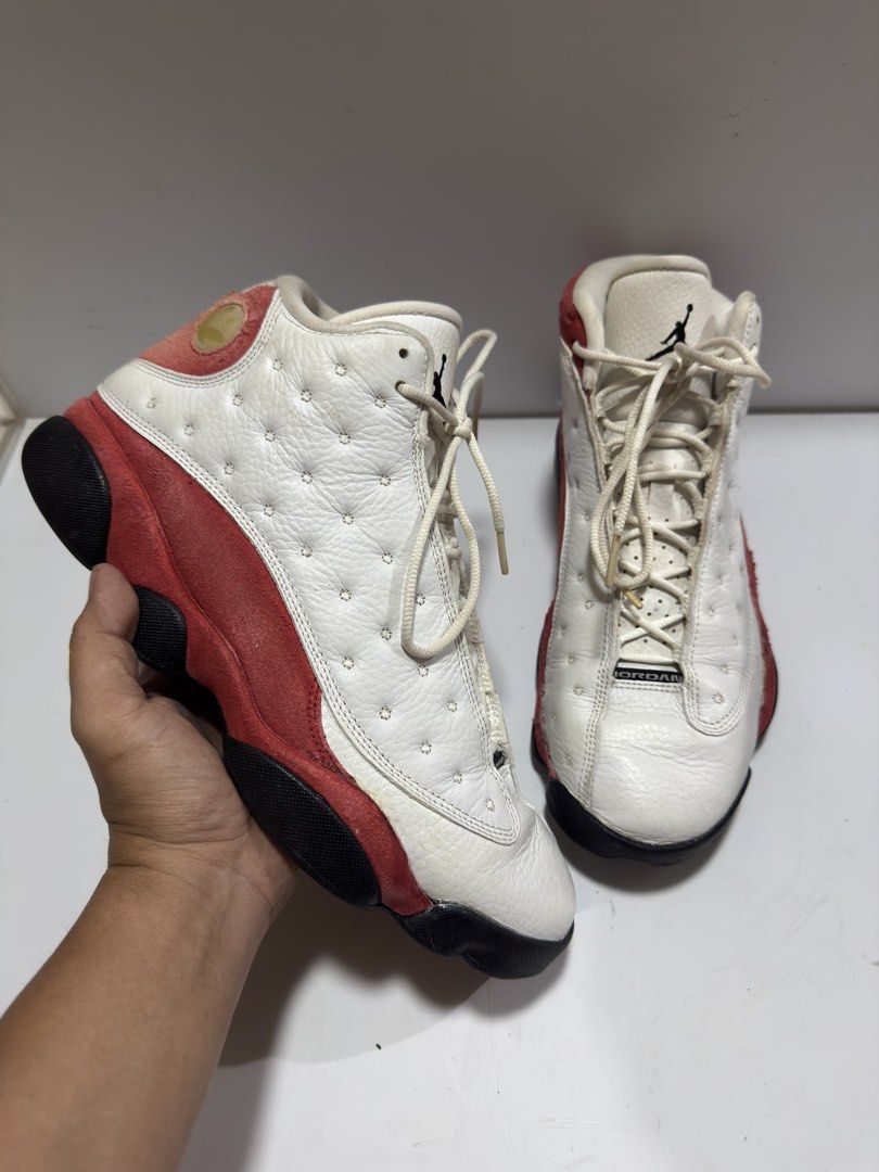 Jordan 13 Retro OG Chicago 2017 (Category: Sneakers) located in Manila. Submitted by mislangers_stuff (Listing ID 1455139482, Image 2). Description: - Classic Air Jordan 13s - Colorway: White, Red, Black - Size: US Men's 9.5 - Condition: Used, with visible wear on soles and suede - Still has plenty of life left for wear - Ideal for Air Jordan collectors or casual wear.
