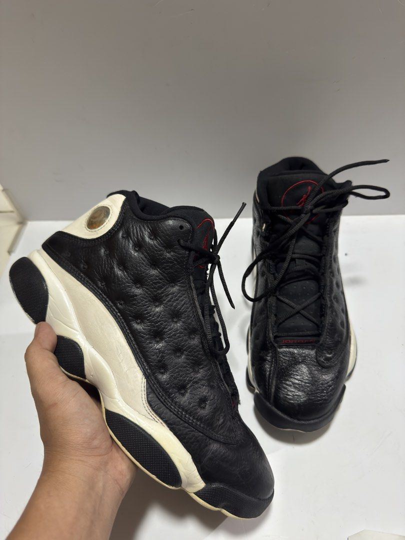 Jordan 13 Retro Reverse HGG (Category: Sneakers) located in Manila. Submitted by mislangers_stuff (Listing ID 1455138084, Image 2). Description: - Classic black and white Air Jordan 13s - Red accents on tongue and heel - Mid-top style - Textured leather upper - White and black sole - Ideal for collectors or everyday wear.