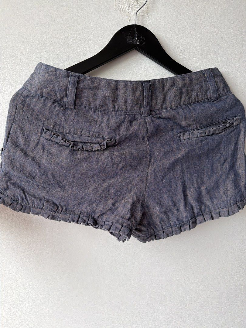 Jovovich-Hawk for Target Linen Shorts Size 3 (Category: Shorts) located in Makati City. Submitted by cheapipie (Listing ID 1455044346, Image 3). Description: - 100% Linene Cute Jovovich-Hawk for Target linen shorts - Dark blue/grey wash - Features button details and ruffled trim - Fun star print lining inside the waistband - Made of 100% linen - Great for summer wear.