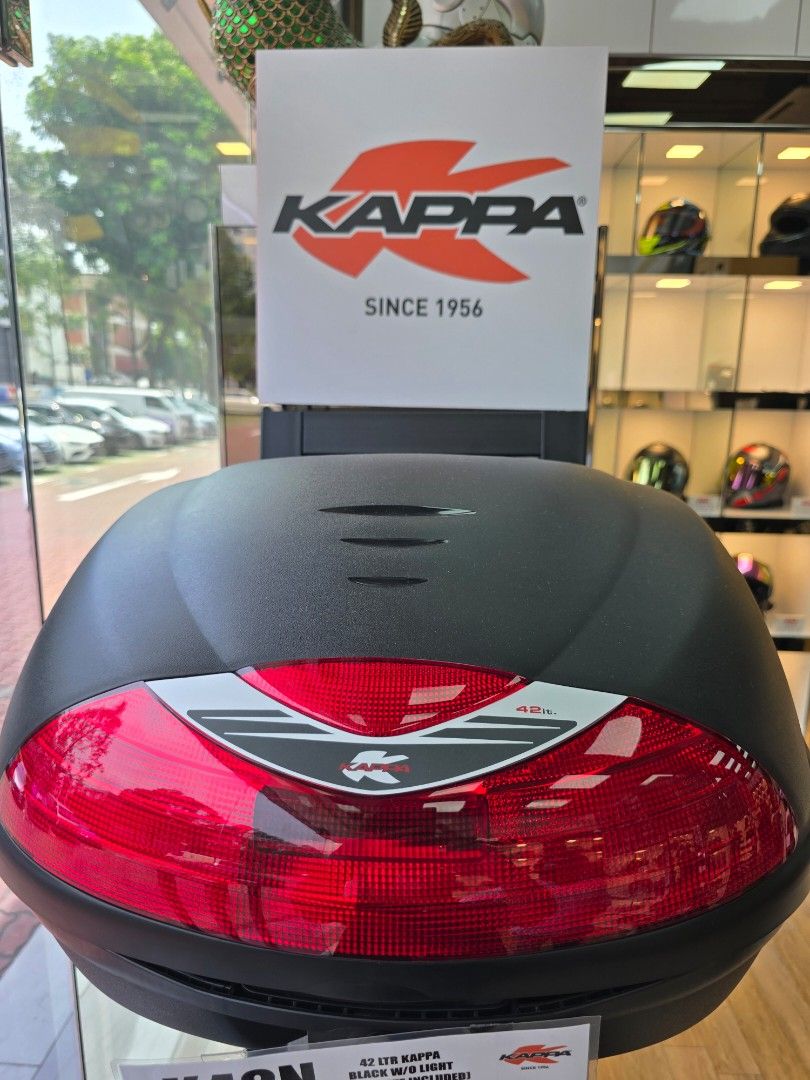 Kappa K42 Top Case (Category: Motorcycle Accessories) located in Singapore. Submitted by ijansue (Listing ID 1454989708, Image 3). Description: Got this for free after purchase from Racing World. Brand new box and still in plastic seal. Let's deal! - Kappa 42L MONOLOCK® Top-Case - Color: Black with red reflectors (K42N) - Capacity: 42 liters, fits 2 helmets - Features: Water-resistant, universal mounting plate included - Ideal for scooters and sm