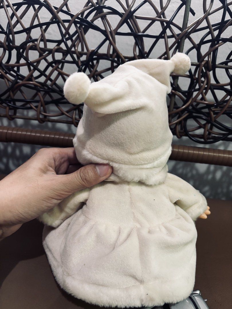 Kewpie Winter (Category: Plushies & Soft Toys) located in Manila. Submitted by millenial_cabinet (Listing ID 1455072855, Image 2). Description: - Adorable white plush doll - Comes with a matching hat and outfit - Features a red heart with Japanese writing on the front - Battery compartment located at the back - Includes a small silver toy car - Approximately [insert height here] tall - Ideal for collectors or as a thoughtful gift.