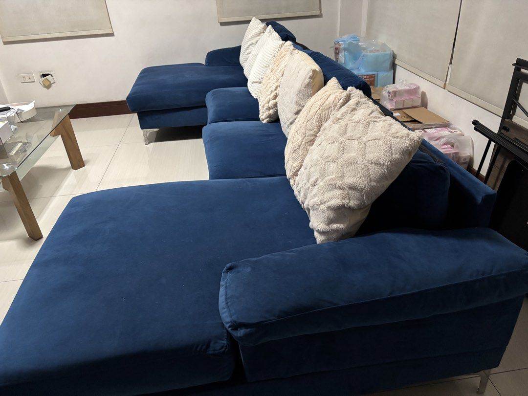 Large Blue C-Shaped Sofa (Category: Sofas) located in Quezon City. Submitted by glc157 (Listing ID 1454957163, Image 2). Description: - Spacious C/U-shaped sectional sofa - Deep blue velvet fabric - Ample seating for the whole family - Modern design with sleek metal legs - Ideal for living rooms or entertainment areas - Easy to arrange in different configurations Original price: 30k RFS: changing furniture.