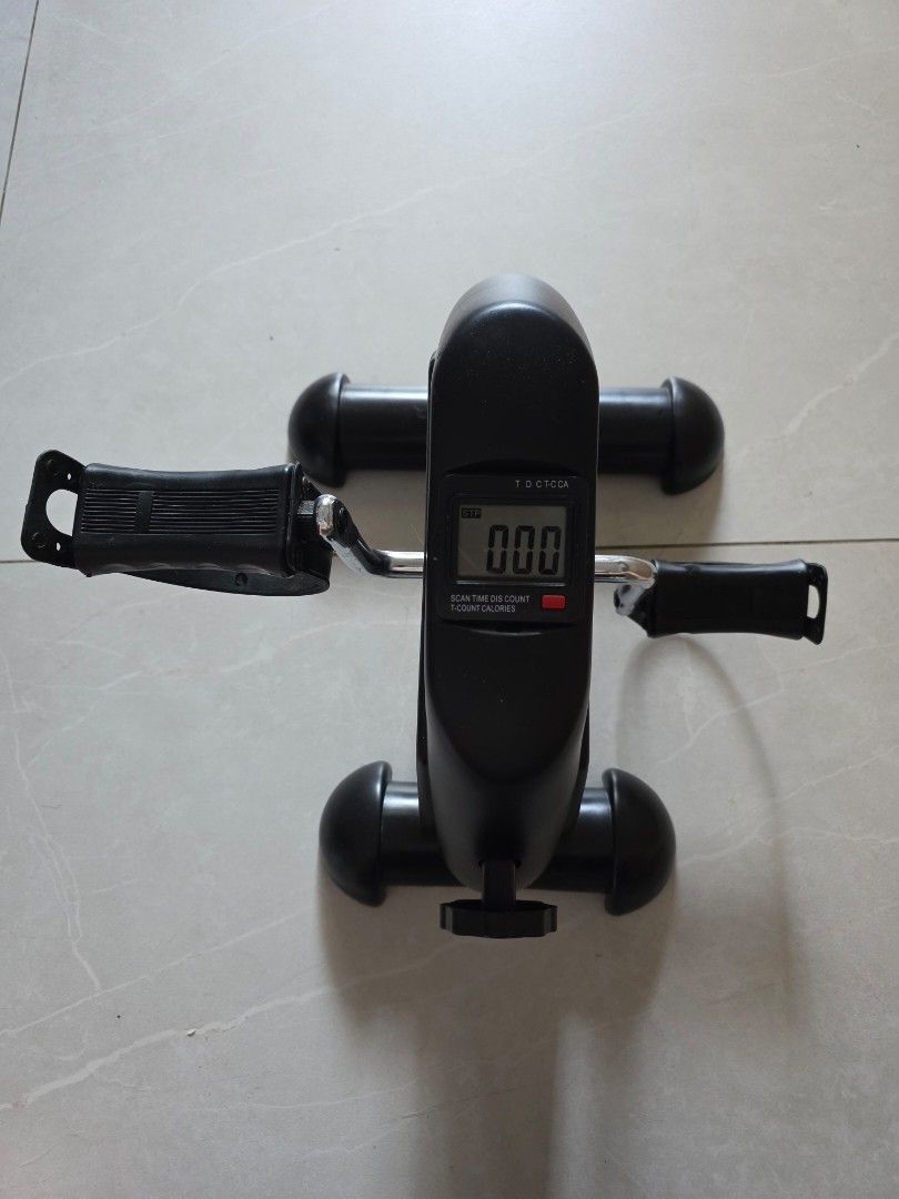 Exercise machine (Category: Cardio & Fitness Machines) located in Singapore. Submitted by purejoy2021 (Listing ID 1454970081, Image 1). Description: - Compact pedal exerciser, perfect for home use. - Digital display tracks: scan, time, distance, count, and calories burned. - Adjustable resistance knob for personalized workout intensity. - Suitable for exercising both legs and arms. - Easy to store and use anywhere for convenient light exercise..