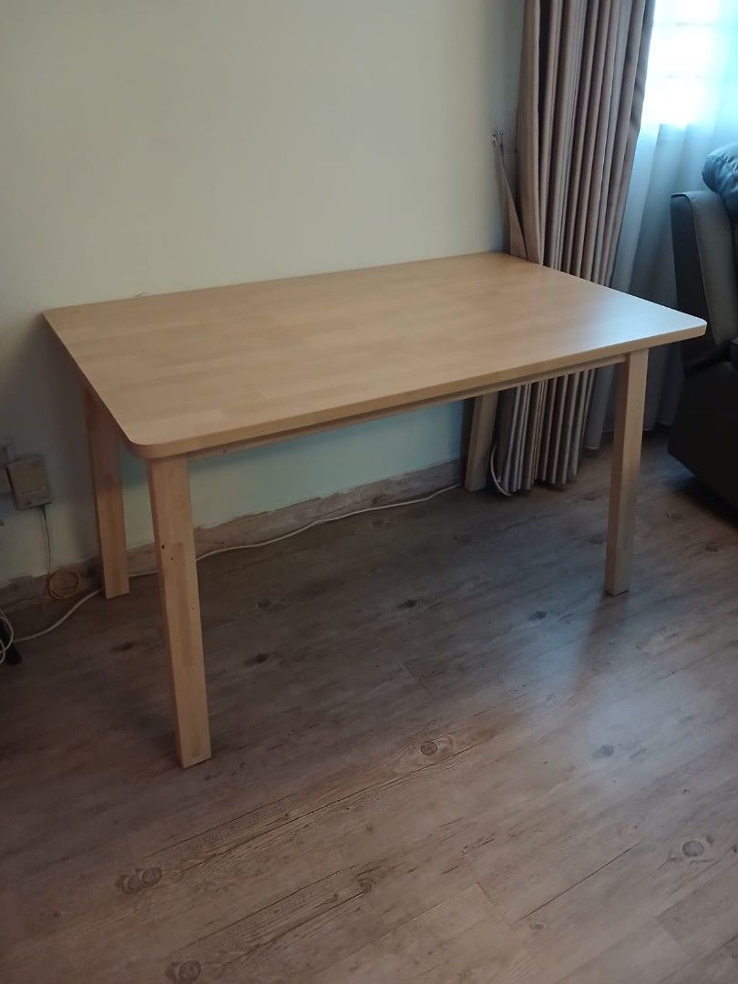 Solid Wood Dining Table (Category: Tables & Sets) located in Singapore. Submitted by rohg4112 (Listing ID 1454994766, Image 2). Description: - Solid wood dining table - Rectangular shape with rounded corners - Sturdy legs - Ideal for small dining areas or as a workspace - Easy-to-clean surface - Comfortably seats four chairs(chairs not included) - Selling as is. Bought this table alone for $279 but it was seldom used for dining. Hence, I am willi