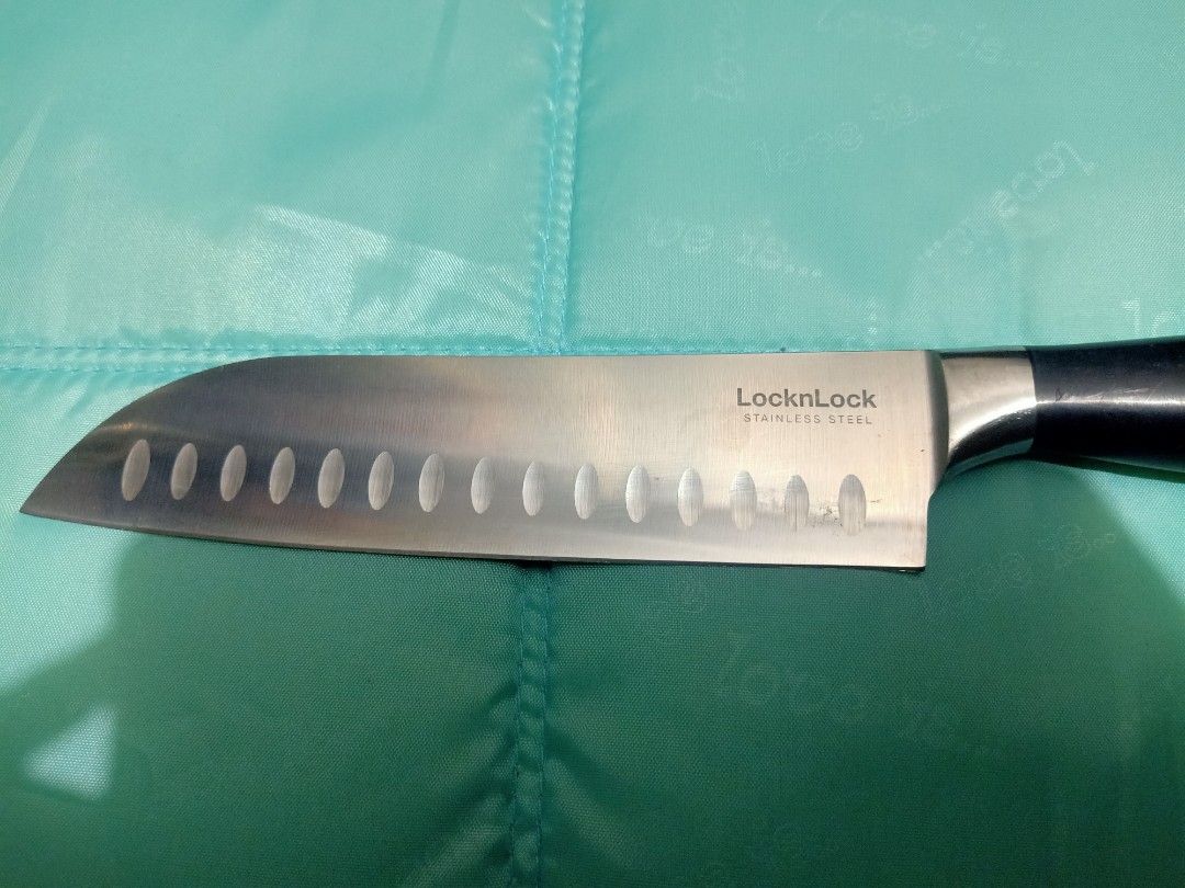 Lock n lock stainless steel santuko knives (Category: Knives & Chopping Boards) located in Pasig City. Submitted by urdal01 (Listing ID 1455106958, Image 2). Description: - LocknLock stainless steel Santoku knife - featuring a granton-edged blade and an ergonomic black handle. -Design & Purpose: This 6.5-inch multipurpose kitchen knife excels at three primary cutting tasks: slicing, dicing, and mincing. - The hollow indentations (granton edge) al