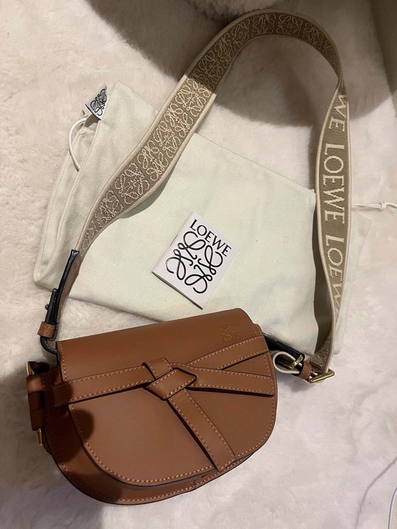 Loewe Gate Dual Mini Bag Tan Leather (Category: Luxury Bags & Wallets) located in Manila. Submitted by kperez2516 (Listing ID 1455041530, Image 2). Description: - Authentic Loewe Gate Dual Mini bag - Color: Tan - Material: Calfskin leather - Signature anagram strap - Includes dust bag and authenticity card - Adjustable strap for crossbody or shoulder wear - Classic and versatile design for daily use.