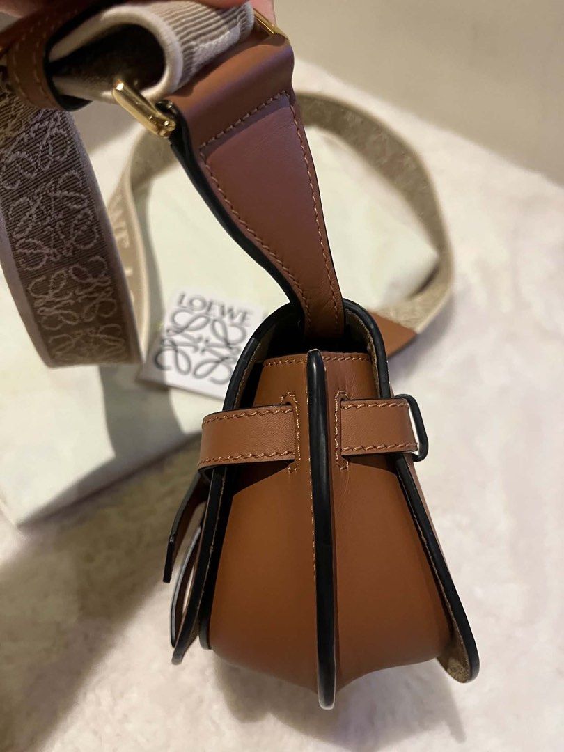 Loewe Gate Dual Mini Bag Tan Leather (Category: Luxury Bags & Wallets) located in Manila. Submitted by kperez2516 (Listing ID 1455041530, Image 3). Description: - Authentic Loewe Gate Dual Mini bag - Color: Tan - Material: Calfskin leather - Signature anagram strap - Includes dust bag and authenticity card - Adjustable strap for crossbody or shoulder wear - Classic and versatile design for daily use.