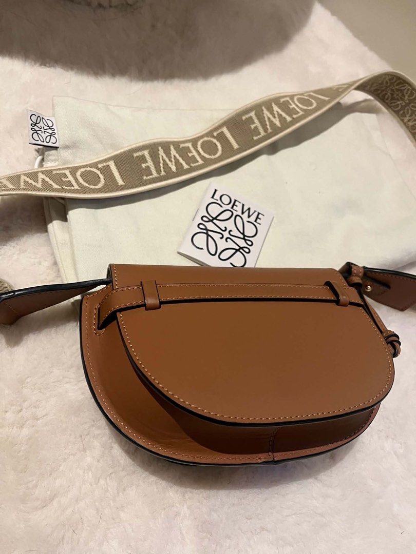 Loewe Gate Dual Mini Bag Tan Leather (Category: Luxury Bags & Wallets) located in Manila. Submitted by kperez2516 (Listing ID 1455041530, Image 1). Description: - Authentic Loewe Gate Dual Mini bag - Color: Tan - Material: Calfskin leather - Signature anagram strap - Includes dust bag and authenticity card - Adjustable strap for crossbody or shoulder wear - Classic and versatile design for daily use.