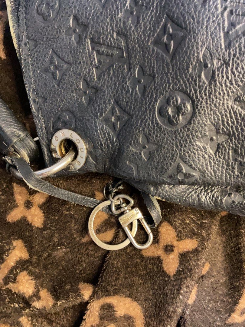 Louis Vuitton Black Leather Monogram Shoulder Bag (Category: Luxury Bags & Wallets) located in Paranaque City. Submitted by eller_2 (Listing ID 1455115884, Image 2). Description: Pre-loved - Authentic Louis Vuitton shoulder bag - Black leather with classic monogram pattern - Braided handle detail - Multiple interior compartments - Interior zip pocket - Made in France - Shows some signs of wear on exterior and corners.