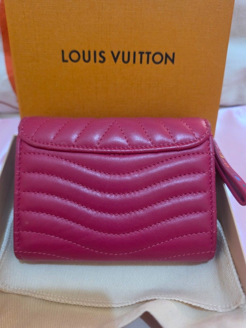 Louis Vuitton New Wave trifold Wallet (Category: Luxury Bags & Wallets) located in Cavite. Submitted by kazi_preloved (Listing ID 1454966090, Image 3). Description: - 100% Authentic Louis Vuitton wallet - Vibrant pink color in gold hardware - quilted calfskin leather - Envelope style with snap closure - Multiple card slots - Interior zip pocket - Comes with original box and dust bag.