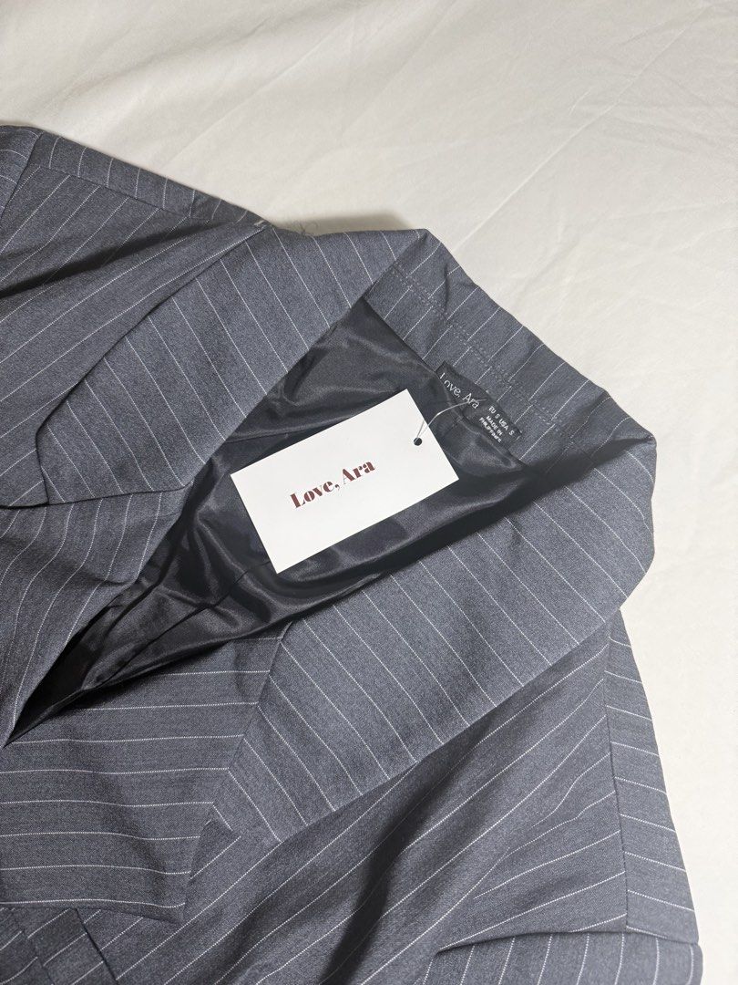 Love, Ara Oversized Dark Gray Stripes Double Breasted Blazer (Category: Coats, Jackets and Outerwear) located in Quezon City. Submitted by minispirea (Listing ID 1455124266, Image 3). Description: Brand new with tag attached Oversized / runs big • On hand & ready to ship • More photos/videos available upon request • Pay as you order • No returns or exchanges Location: Quezon City / BGC Delivery: • Weekdays — same-day evening or next-day delivery 