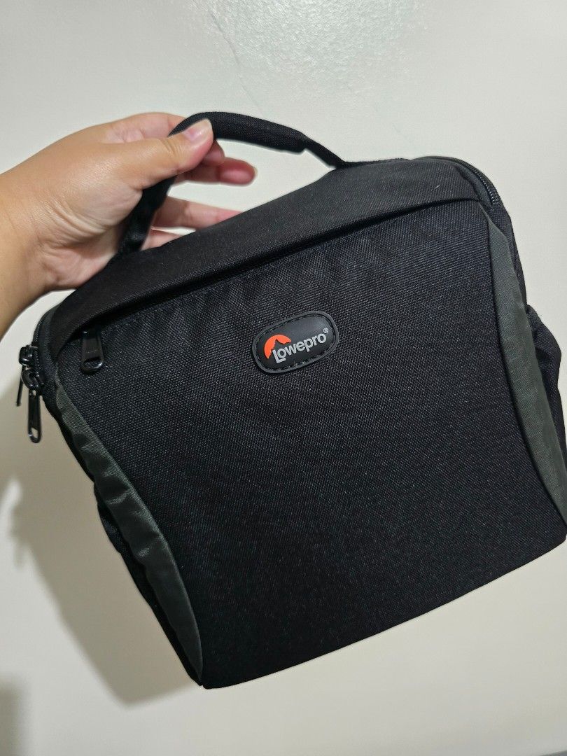 Lowepro Format 160 Camera Bag (Category: Camera Bags & Carriers) located in Makati City. Submitted by nikin07 (Listing ID 1454972541, Image 1). Description: - Brand: Lowepro - Model: Format 160 - Features padded dividers for camera gear - Includes a mesh pocket for accessories - Comes with a handle and a removable shoulder strap - Designed for excellent camera and lens protection.