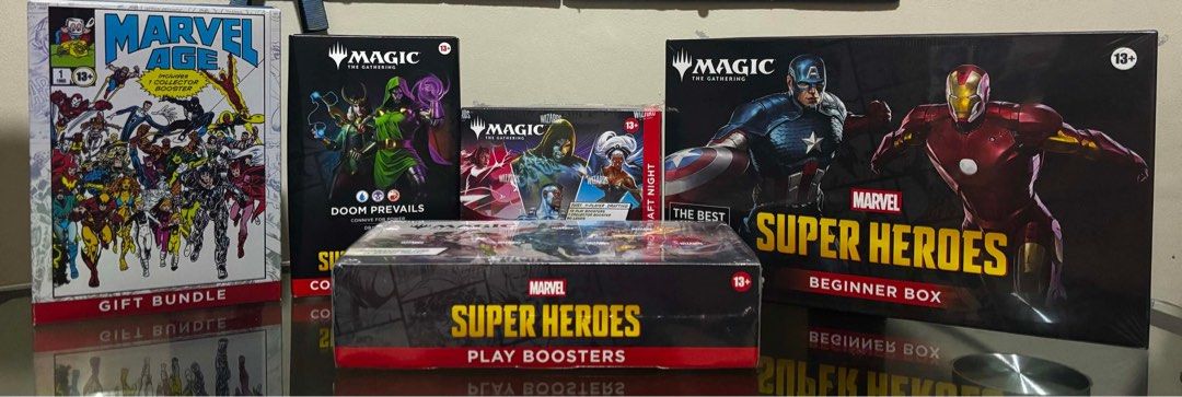 Magic The Gathering & Marvel Super Heroes Booster Boxes & Decks (Category: Card Boxes & Cases) located in Manila. Submitted by mimi18246 (Listing ID 1455047618, Image 1). Description: - Sealed Magic The Gathering Marvel Super Heroes Bundle - Includes: Play Boosters, 2 Beginner Boxes, 1 Commander Deck, 1 Draft Night Box - All items are brand new and sealed - Ideal for both collectors and players FOR SALE - MSH Sealed Products MSH Doom Prevails Pre