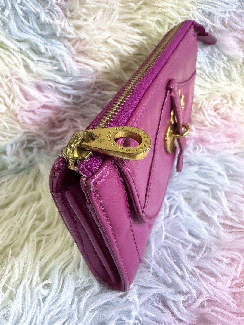 Marc By Marc Jacobs Leather wallet (Category: Luxury Bags & Wallets) located in Rizal. Submitted by affordabagz (Listing ID 1455040327, Image 3). Description: 🏷️ Brand: MARC BY MARC JACOBS — engraved zipper pull ✨ Material: Genuine leather — vibrant magenta / fuschia pink 🏭 Origin: Made in China — style code: M3113446 📂 Style: Long zip-around wallet with front flap & gold-tone logo hardware 💳 Features: Multiple card slots, bill compartments, 