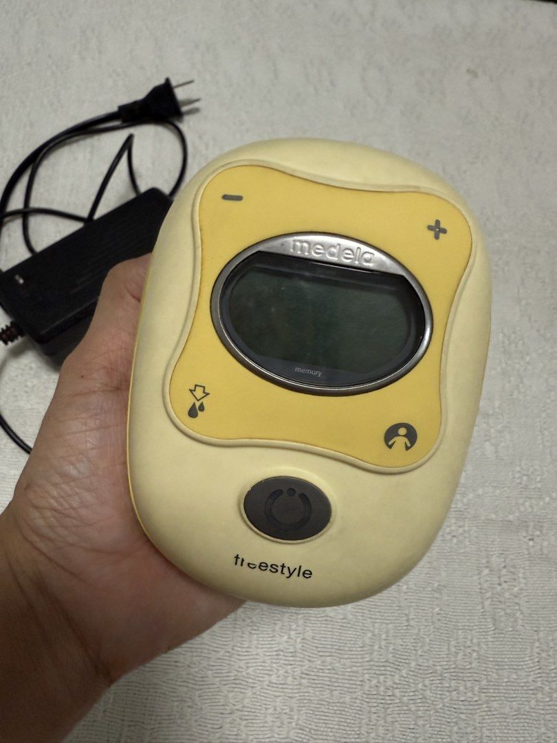 Medela Freestyle Breast Pump with Power Adapter (Category: Breastfeeding & Bottle Feeding) located in Quezon City. Submitted by purplenest (Listing ID 1455003088, Image 2). Description: - Medela Freestyle breast pump - Includes power adapter - Features display screen and adjustable settings - Memory function for saved preferences - Built-in clip for convenient on-the-go use.