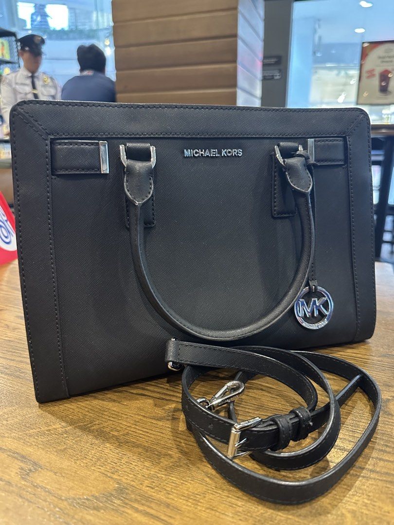 Michael Kors Black Leather Satchel Handbag (Category: Luxury Bags & Wallets) located in Antipolo. Submitted by santigao25 (Listing ID 1455004240, Image 1). Description: Classic black leather satchel from Michael Kors. Silver hardware details. Comes with a detachable shoulder strap. Spacious interior. Great for work or everyday use. Clean and well-maintained..
