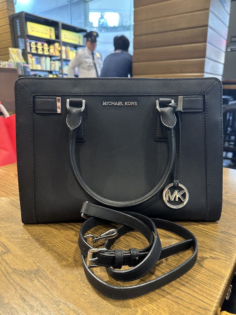 Michael Kors Black Leather Satchel Handbag (Category: Luxury Bags & Wallets) located in Antipolo. Submitted by santigao25 (Listing ID 1455004240, Image 2). Description: Classic black leather satchel from Michael Kors. Silver hardware details. Comes with a detachable shoulder strap. Spacious interior. Great for work or everyday use. Clean and well-maintained..