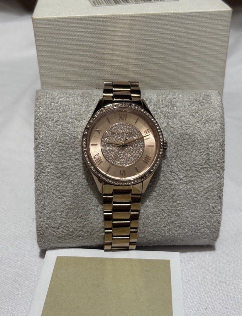 Michael Kors Rose Gold Crystal Watch (Category: Women's Watches) located in Cavite. Submitted by 004_aa (Listing ID 1455030691, Image 2). Description: - Rose gold Michael Kors watch - Stunning crystal-covered face - Elegant Roman numeral dial - Comes with original box and booklet - Versatile for dressing up or everyday wear issue: minor scratches and missing stones! links are complete and battery is still original .