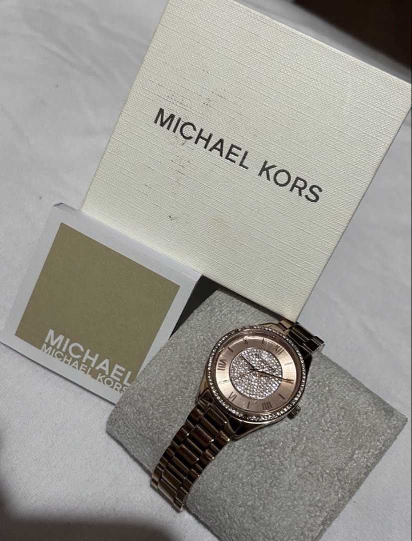 Michael Kors Rose Gold Crystal Watch (Category: Women's Watches) located in Cavite. Submitted by 004_aa (Listing ID 1455030691, Image 1). Description: - Rose gold Michael Kors watch - Stunning crystal-covered face - Elegant Roman numeral dial - Comes with original box and booklet - Versatile for dressing up or everyday wear issue: minor scratches and missing stones! links are complete and battery is still original .