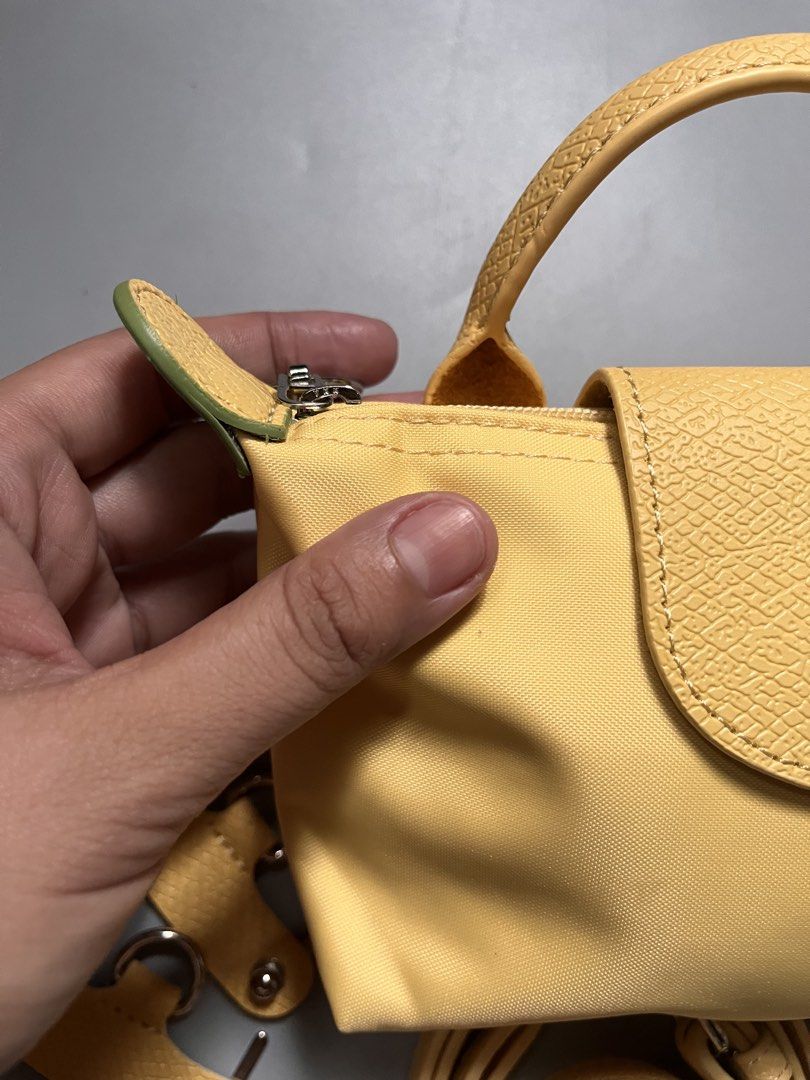Micro sling longchamp (Category: Luxury Bags & Wallets) located in San Jacinto. Submitted by kellysthrift_ (Listing ID 1455105035, Image 2). Description: Lemon Micro Longchamp .