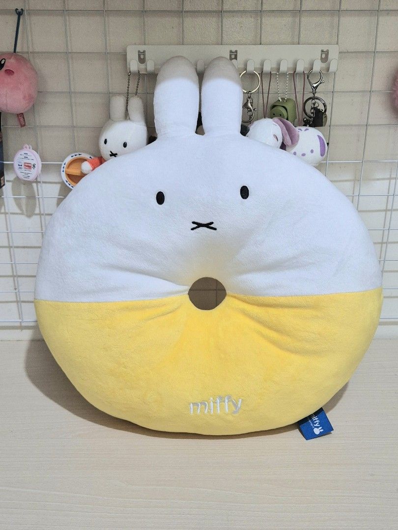 Miffy Donut Cushion Pillow Yellow (Category: Plushies & Soft Toys) located in Paranaque City. Submitted by akinoheya (Listing ID 1455035283, Image 3). Description: - Adorable Miffy donut cushion - Super soft and squishy - Features embroidered Miffy logo on yellow part - Ideal for couch or bed decor - A must-have for any Miffy fan - Approximately 40cm in diameter - Comes with original tag.