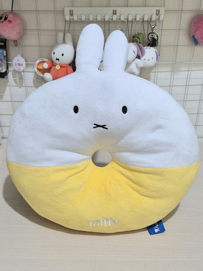 Miffy Donut Cushion Pillow Yellow (Category: Plushies & Soft Toys) located in Paranaque City. Submitted by akinoheya (Listing ID 1455035283, Image 2). Description: - Adorable Miffy donut cushion - Super soft and squishy - Features embroidered Miffy logo on yellow part - Ideal for couch or bed decor - A must-have for any Miffy fan - Approximately 40cm in diameter - Comes with original tag.