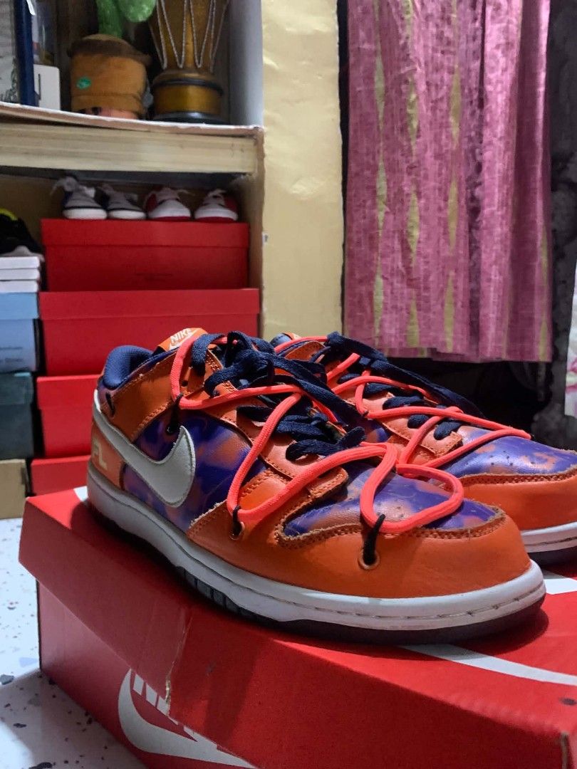 Nike Dunk Low Off-White Lot 17 (Category: Sneakers) located in Manila. Submitted by ja_thrift. (Listing ID 1455017984, Image 2). Description: - Authentic Nike Dunk Low Off-White sneakers - Lot 17 from the 2019 collection - Eye-catching orange and purple colorway - Signature Off-White detailing - Size: US 9.5 - Comes with original box.