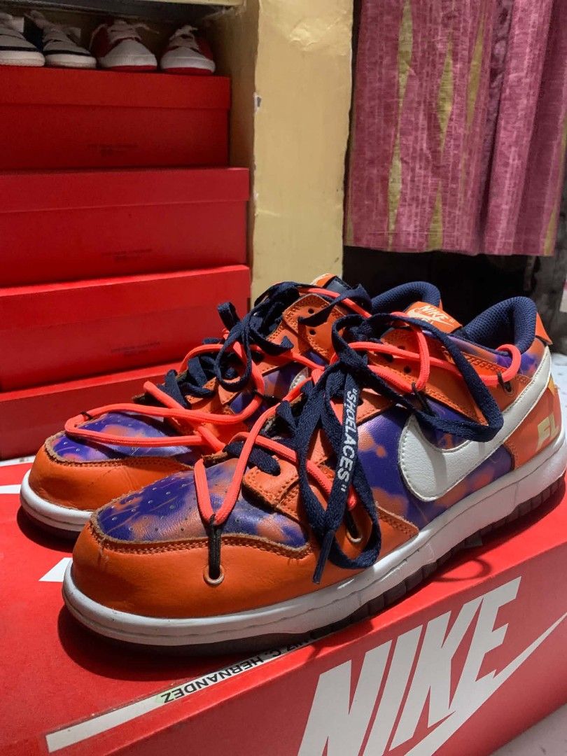 Nike Dunk Low Off-White Lot 17 (Category: Sneakers) located in Manila. Submitted by ja_thrift. (Listing ID 1455017984, Image 3). Description: - Authentic Nike Dunk Low Off-White sneakers - Lot 17 from the 2019 collection - Eye-catching orange and purple colorway - Signature Off-White detailing - Size: US 9.5 - Comes with original box.