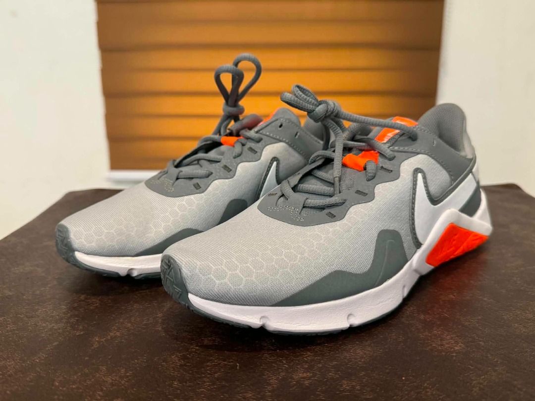 Nike Legend Essential 2 "Wolf Grey Total Orange" | US 7 | Authentic | Deadstock (Category: Sneakers) located in Paranaque City. Submitted by juliusd23 (Listing ID 1455003194, Image 1). Description: Size: US 7 / UK 6 / EUR 40 / 25cm — check the size chart, this one runs true-to-size for most. 💯 100% Authentic — verified style code CQ9356-007, matching UPC, and factory QR tag (photos of the label included, so you can double-check before you even m