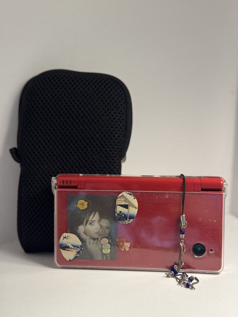 Nintendo | DSi TWL-001 (Red) [tags: retro, console, switch, gaming] (Category: Nintendo) located in San Juan City. Submitted by 54lovjaee (Listing ID 1393546021, Image 2). Description: DISCLAIMER ❗️ •No issues but please manage your expectations •In Japanese Language INCLUSIONS ❗️ •Charger (Cable Only) •Bag Pouch •Transparent Hard Case Cover •R4 Gold Pro SDHC W/ USB Adapter •NO SD CARD INCLUDED Can and will send videos. Just DM 📩 me! Year releas