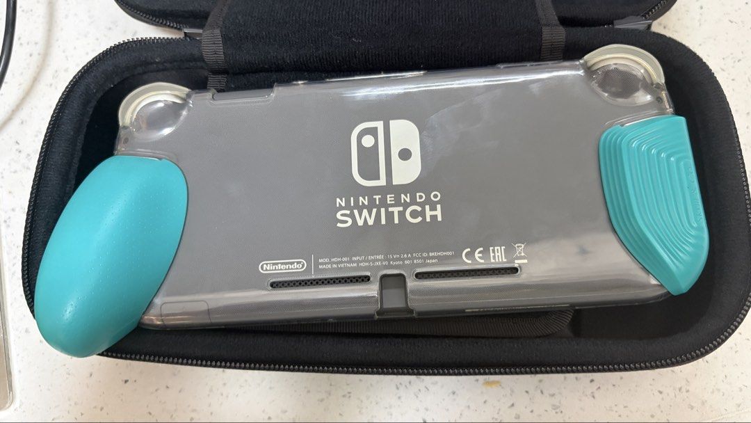 Nintendo Switch Lite Gray with Skull & Co Grip/Case and 128gb microSD (Category: Nintendo) located in Cavite. Submitted by jace.themerchant (Listing ID 1454996770, Image 2). Description: Nintendo Switch Lite Gray with Skull & Co Grip/Case Package includes - Switch Lite - Original Box - Original Charger - Skull & Co case - Skull & Co clear grip - 128 GB Memory Card - Tested working 100% - No stick drift. No major scratches. - No dead pixels - No g