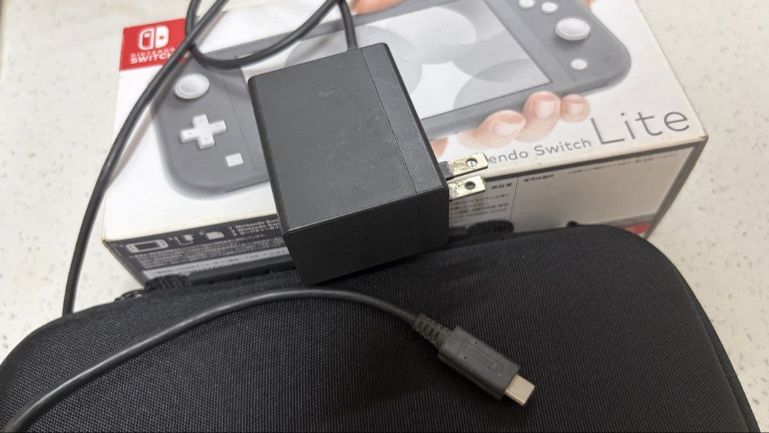 Nintendo Switch Lite Gray with Skull & Co Grip/Case and 128gb microSD (Category: Nintendo) located in Cavite. Submitted by jace.themerchant (Listing ID 1454996770, Image 3). Description: Nintendo Switch Lite Gray with Skull & Co Grip/Case Package includes - Switch Lite - Original Box - Original Charger - Skull & Co case - Skull & Co clear grip - 128 GB Memory Card - Tested working 100% - No stick drift. No major scratches. - No dead pixels - No g
