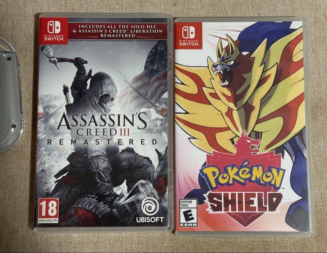 Nintendo Switch Lite Zacian & Zamazenta (Category: Nintendo) located in Calamba. Submitted by thriftsterph (Listing ID 1455089805, Image 3). Description: RFS: Declutterring Generally in good condition Only Issue: Slight LCD vignette (barely noticeable during game play) Inclusions: Game: Pokemon Sheild (Card) Game: Assassin’s Creed (Card) Game: Jump Force (Digital) Accessories: Crystal Case Carbon Fiber Pouch Rubber protector (joystick) Charger .