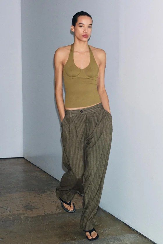 Zara Olive Green Halter Neck Top (Category: Sleeveless) located in Rizal. Submitted by okcath (Listing ID 1455070711, Image 3). Description: Olive green halter neck top. Has a built-in bustier style. Stretchy material. Very flattering cut. Good for a night out or a casual day. Used only once..