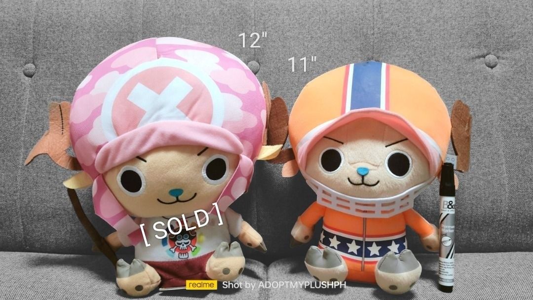 One Piece Tony Tony Chopper Sitting Plush (Category: Plushies & Soft Toys) located in Taguig. Submitted by adopt.my.plush.ph (Listing ID 1448078767, Image 1). Description: ‼️Last Price (LP) Posted 400.00 each *as is, WYSIWYG Stampede Tony Tony Chopper Plush (left) - 12 inches Chopper plush dressed in his signature "Treasure Hunting" attire from the movie, featuring a pink-and-white camouflage patterned hat with a massive white cross, a movie-them