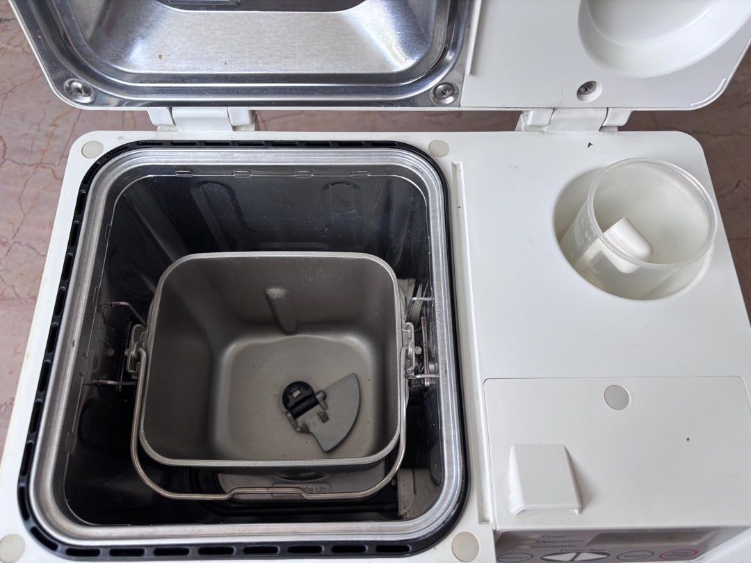 Panasonic Breadmaker (Category: Breadmakers) located in Singapore. Submitted by shl_shl (Listing ID 1455080990, Image 2). Description: Panasonic Breadmaker, pretty old. Last used maybe 15 years ago and kept in storage since then. Have not tested to see if it’s still working. All parts intact, but no instruction manual. I suggest you change the plug! Pick up from off Tanjong Katong Road. No meetup or delivery (item is heavy). .