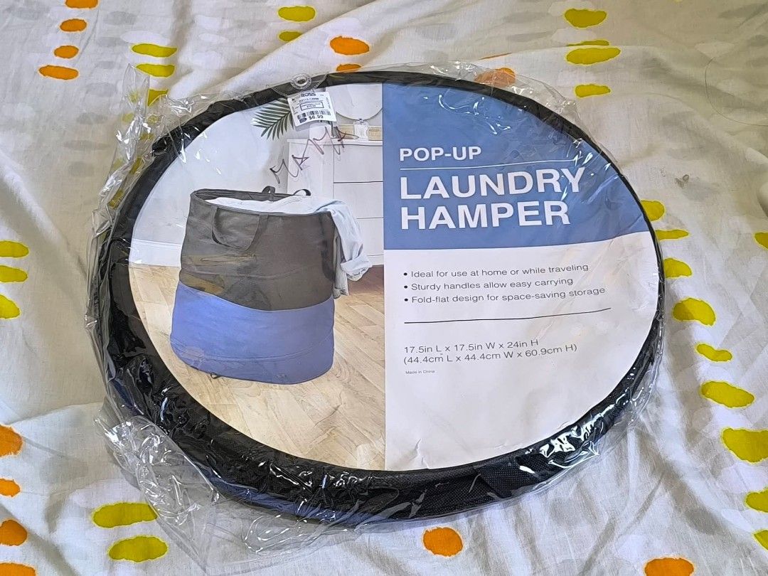 Pop-Up Laundry Hamper - Foldable & Portable (Category: Laundry Baskets) located in General Santos City (Dadiangas). Submitted by animoya (Listing ID 1454956604, Image 1). Description: - Convenient pop-up laundry hamper, ideal for home and travel. - Sturdy handles for easy carrying. - Folds flat for simple storage when not in use. - Dimensions: 17.5"L x 17.5"W x 24"H. - Made in China..