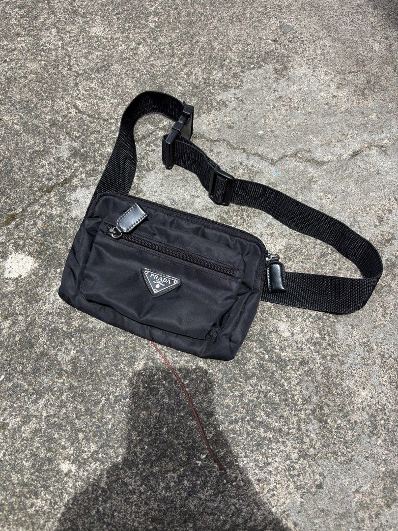 Prada Nylon Belt Bag Black (Category: Luxury Bags & Wallets) located in San Pablo. Submitted by whywethrift (Listing ID 1454987723, Image 1). Description: - Authentic Prada Belt Bag - Color: Black - Material: Nylon - Features: Zippered main compartment, adjustable strap with buckle closure - Details: Small leather zipper pull detail - Use: Ideal for everyday, travel, keeping essentials close and hands-free.