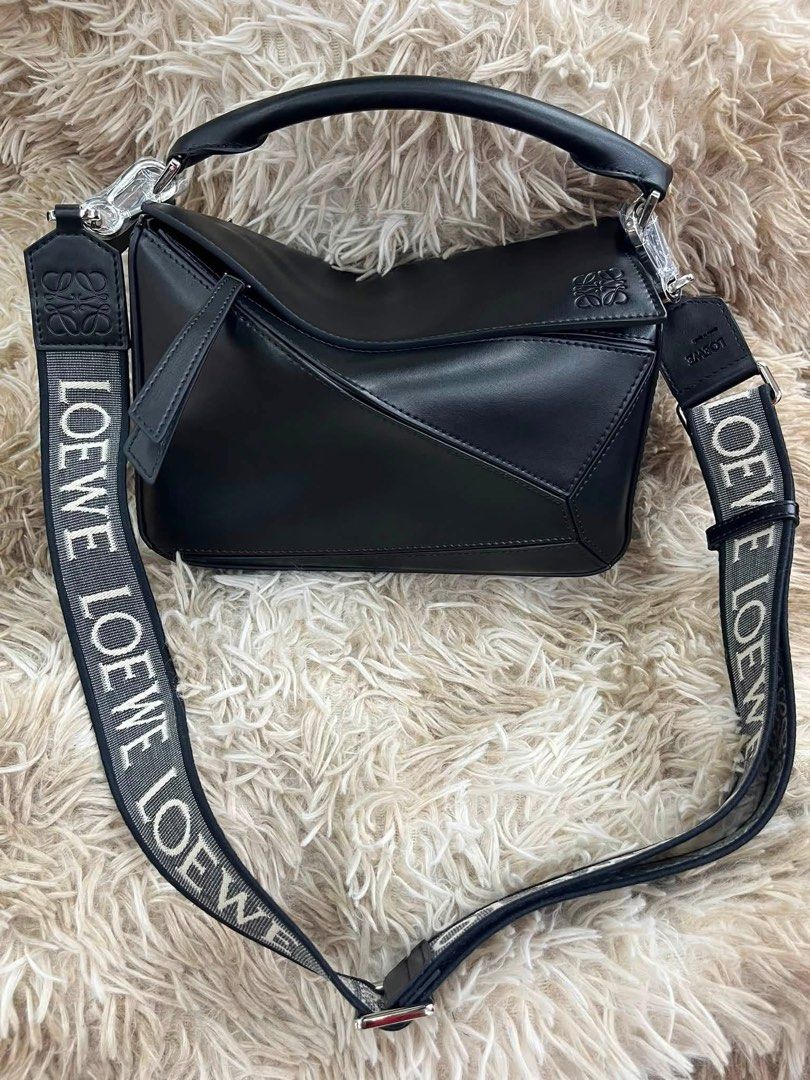 Preloved Loewe Puzzle Bag (Category: Luxury Bags & Wallets) located in Manila. Submitted by bagsandshoesmanymore (Listing ID 1440028754, Image 1). Description: Preloved Loewe Puzzle Bag Calfskin Genuine Leather Good condition Size 24.5cm Japan source Serial number Please read before you order 👉🏻❗️Payment first before shipping ❗️Cut off time of payment 11am sameday delivery ❗️NO MEET UP / NO PICK UP ❗️ORDER CANNOT BE CANCELLED ❗️PLEASE DON’T BUY