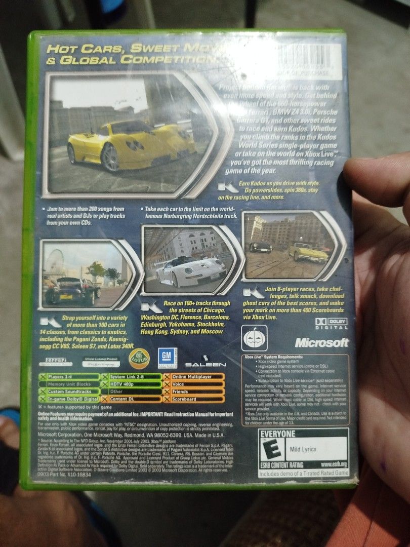 Project Gotham Racing 2 Xbox Game (Category: PlayStation) located in Subic. Submitted by regiedaniel01 (Listing ID 1454979344, Image 3). Description: - Project Gotham Racing 2 for original Xbox - Features hot cars and global competitions - Race on over 100 tracks across cities like Chicago, Washington DC, and Tokyo - Includes online multiplayer - Disc is in the case.