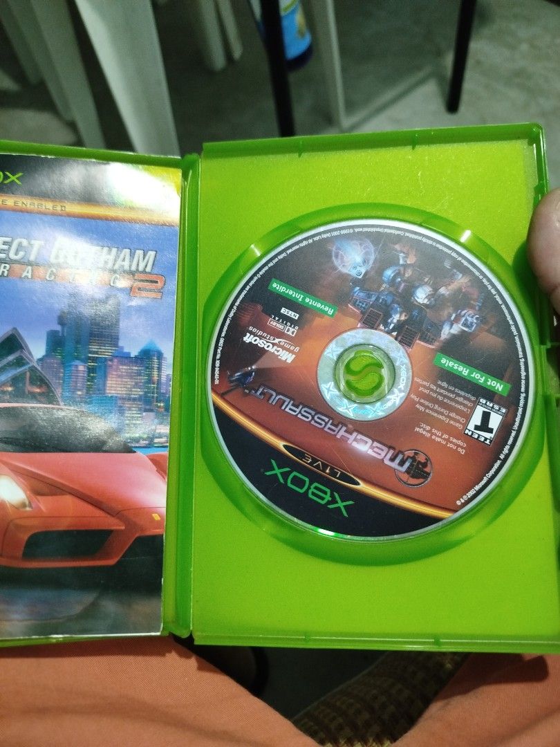 Project Gotham Racing 2 Xbox Game (Category: PlayStation) located in Subic. Submitted by regiedaniel01 (Listing ID 1454979344, Image 2). Description: - Project Gotham Racing 2 for original Xbox - Features hot cars and global competitions - Race on over 100 tracks across cities like Chicago, Washington DC, and Tokyo - Includes online multiplayer - Disc is in the case.