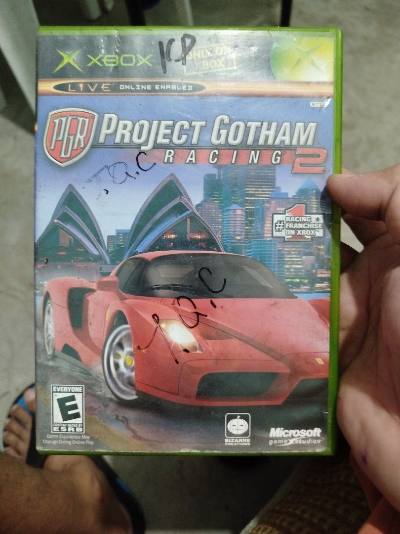 Project Gotham Racing 2 Xbox Game (Category: PlayStation) located in Subic. Submitted by regiedaniel01 (Listing ID 1454979344, Image 1). Description: - Project Gotham Racing 2 for original Xbox - Features hot cars and global competitions - Race on over 100 tracks across cities like Chicago, Washington DC, and Tokyo - Includes online multiplayer - Disc is in the case.