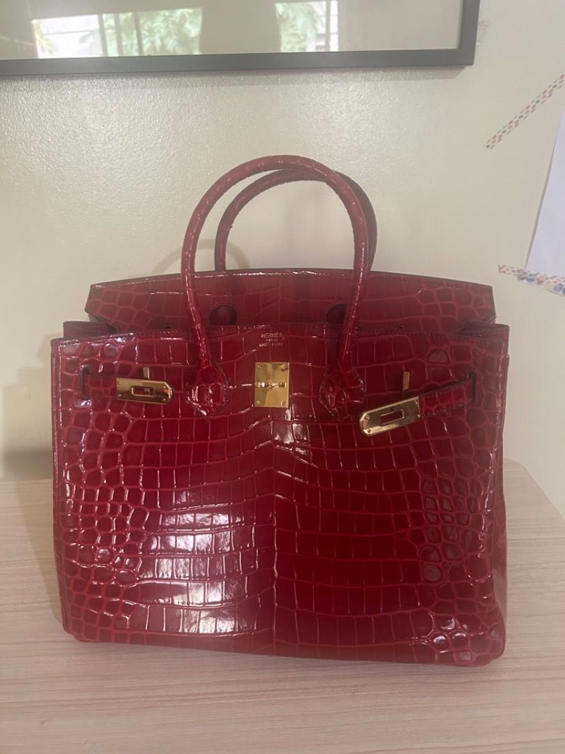 Red Crocodile Embossed Handbag with Gold Hardware (Category: Luxury Bags & Wallets) located in Cebu City. Submitted by serene_simplicity (Listing ID 1454961060, Image 1). Description: -“OG quality” Beautiful red handbag - Crocodile embossed texture - Gold hardware - Classic top handle design - Spacious interior - Statement piece for a pop of color - Versatile for day or night use.