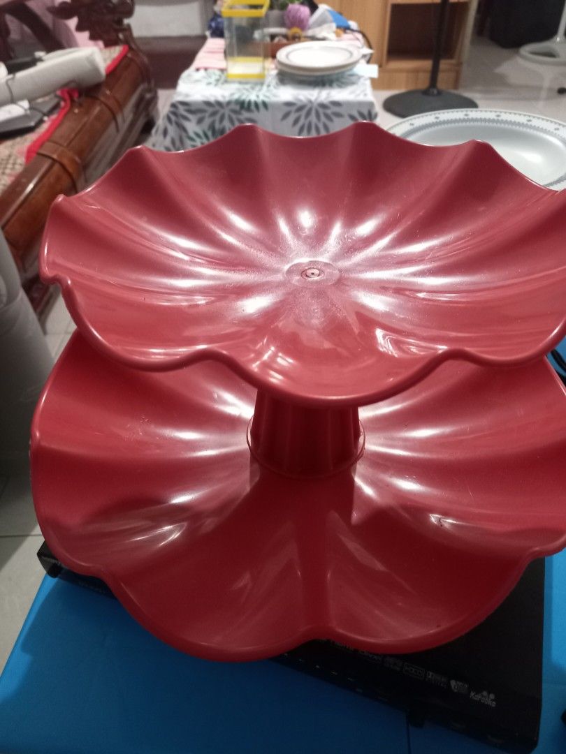Red Plastic Decorative Storage Basket with Floral Cutouts (Category: Storage Boxes & Baskets) located in Manila. Submitted by usefullthings2buy (Listing ID 1454987206, Image 2). Description: - Vibrant red plastic basket - Features a pretty floral cutout design - Ideal size for small items - Great for desk or shelf organization - Perfect for accessories, craft supplies, or small essentials - Lightweight and easy to maintain - Adds a cheerful pop o