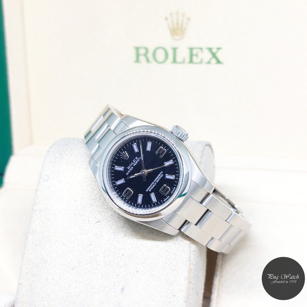 Rolex 26mm Black Dial Oyster Perpetual REF: 176200 (2009) (Category: Watches) located in Singapore. Submitted by pngwatchdealer (Listing ID 1455124192, Image 1). Description: [SPECIFICATIONS] **Watch comes in full option (Box and Card)** **Rehaut ring** **Factory caseback sticker intact** Brand: Rolex Model: Oyster Perpetual 26mm Black Arabic & Batons Dial (REF: 176200)(Z)(09)(O) Movement: Automatic (Self-Winding) Functions and Features: Hours, M