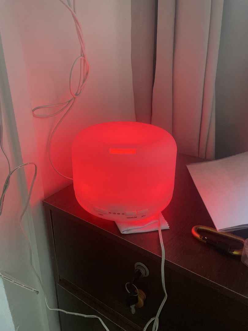 Scent diffuser (Category: Home Fragrance) located in Singapore. Submitted by faisseen (Listing ID 1455045322, Image 2). Description: - scent diffuser (with multiple colours) - mood lighting - Easy to use - Includes plug - Creates a pleasant atmosphere.