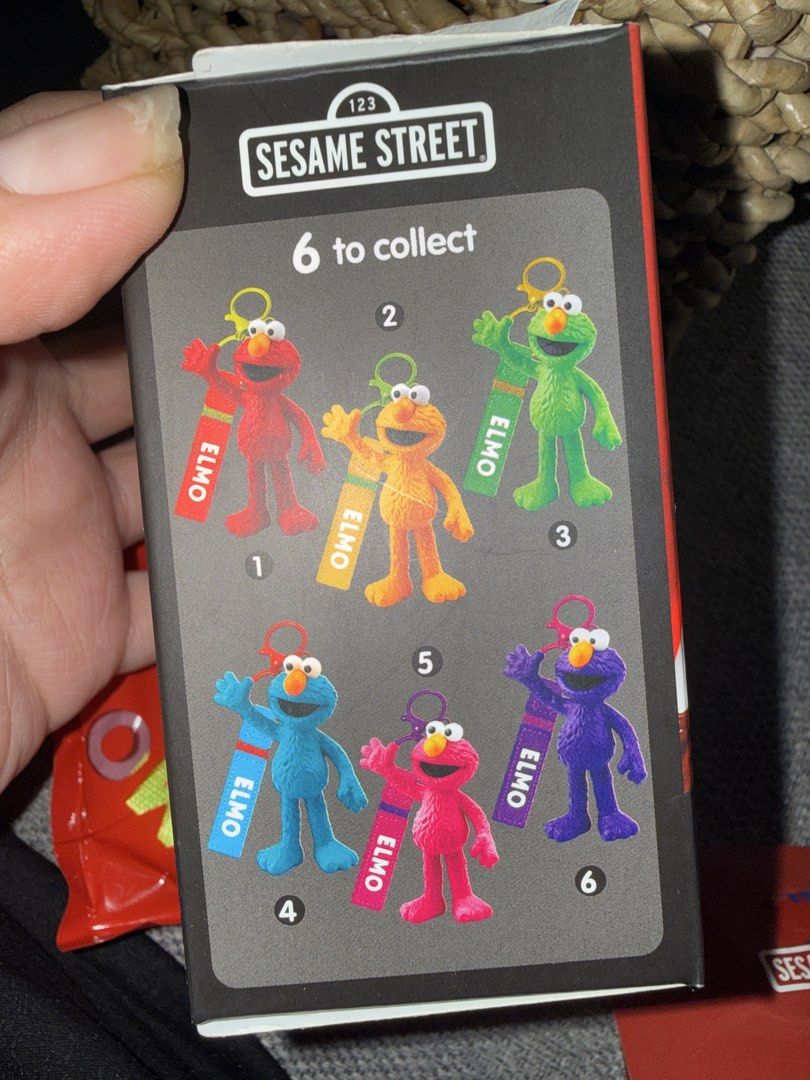 Sesame Street Elmo Figure Keychain Blind Box (Category: Character Goods) located in Caloocan City. Submitted by redandfluffy (Listing ID 1455118097, Image 3). Description: - Sesame Street Elmo blind bag figure keychain - opened box but still sealed: color blue - Collectible: 6 different Elmo designs to find - Ideal gift for Elmo enthusiasts and collectors - Fun mystery toy for kids and adults.